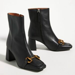 Chic Black Leather Ankle Boots with Gold Accent